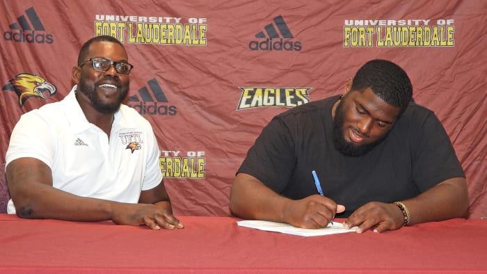 Chris Chambers with a Fort Lauderdale signee